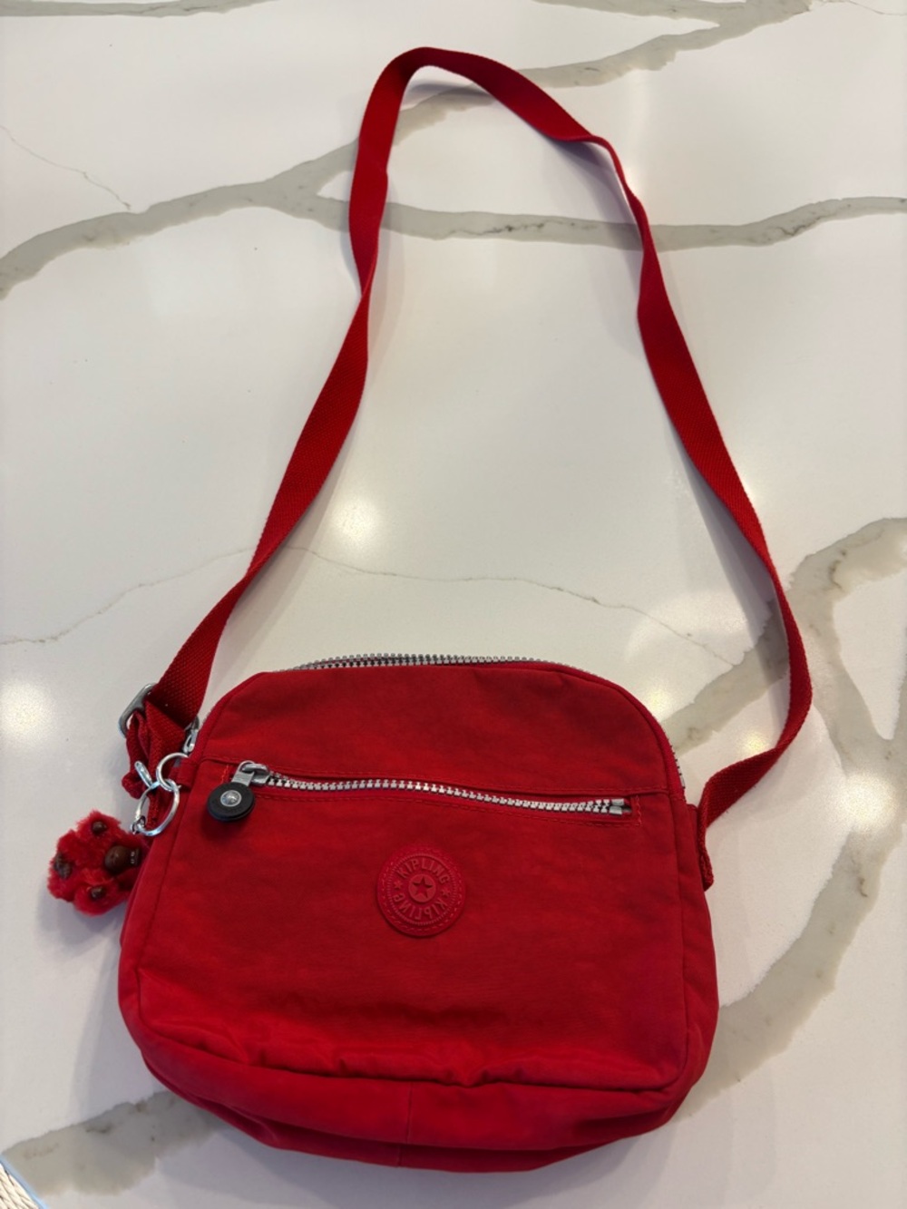 Kipling Vibrant Red Crossbody Bag with Pom-Pom Charm